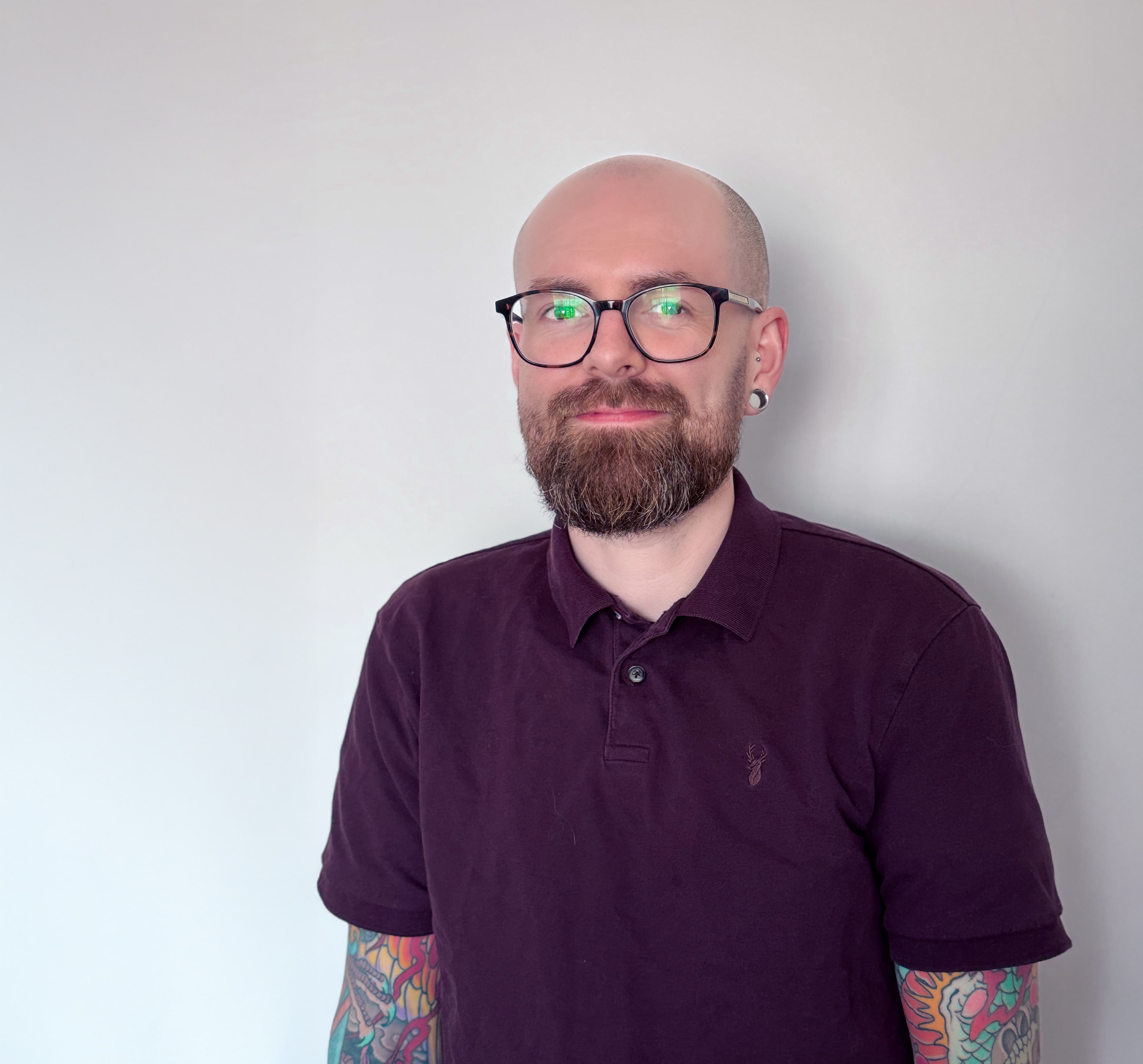 Christopher Broadbent in a softly lit studio, blending developer precision with artist sensibility.